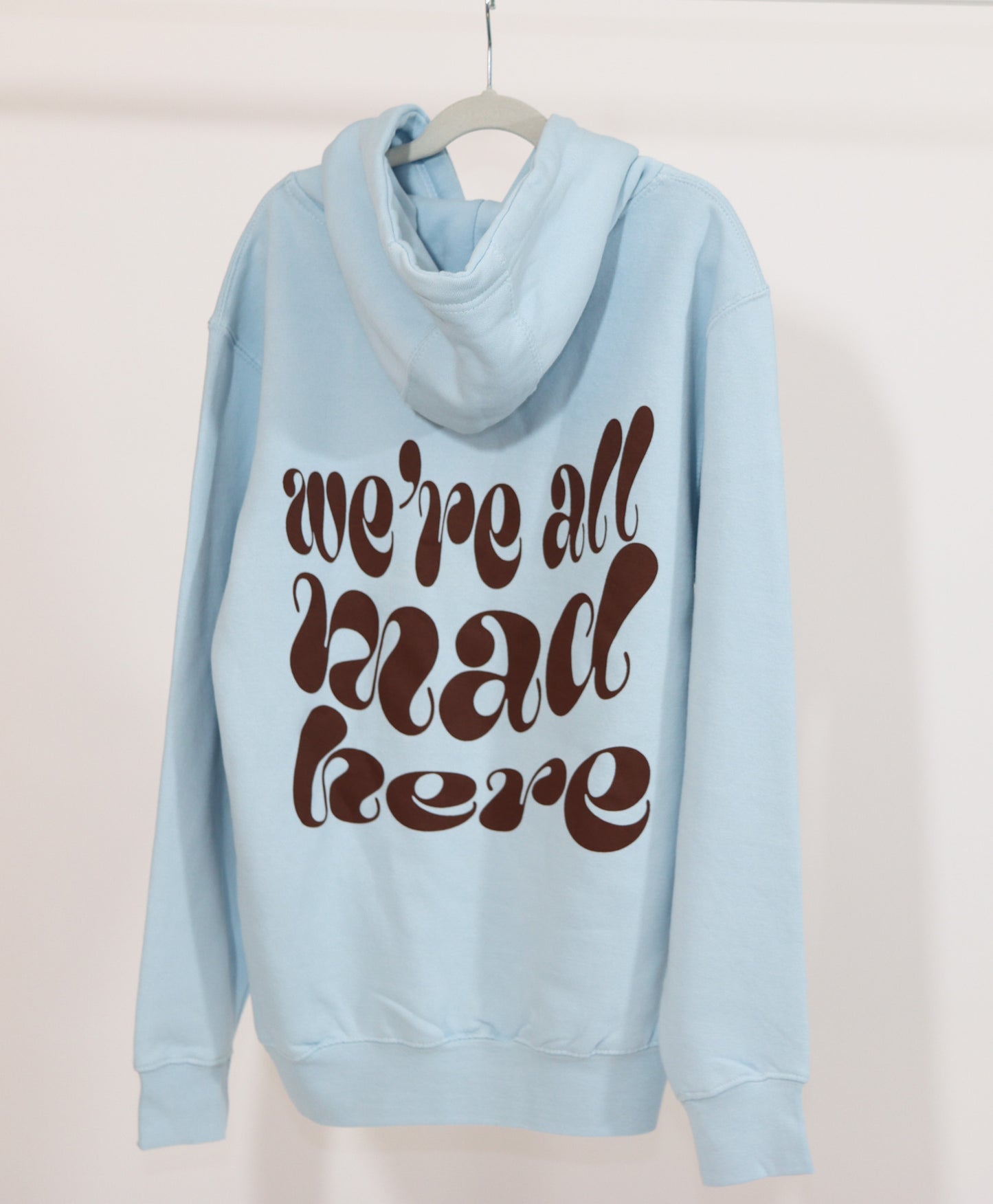 “we’re all mad here” hoodie