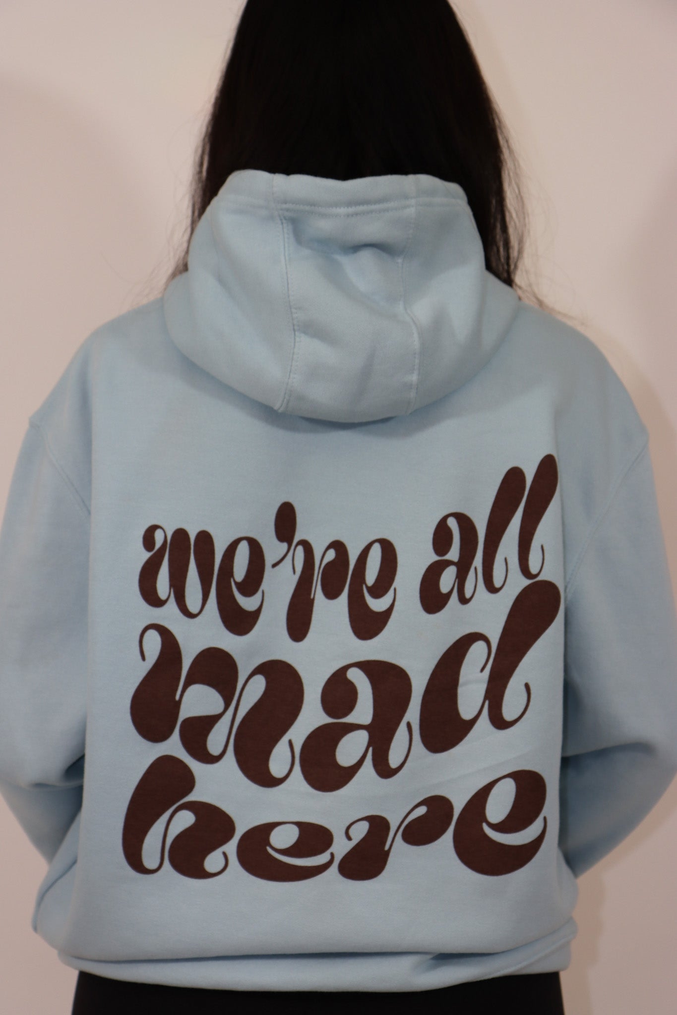 “we’re all mad here” hoodie